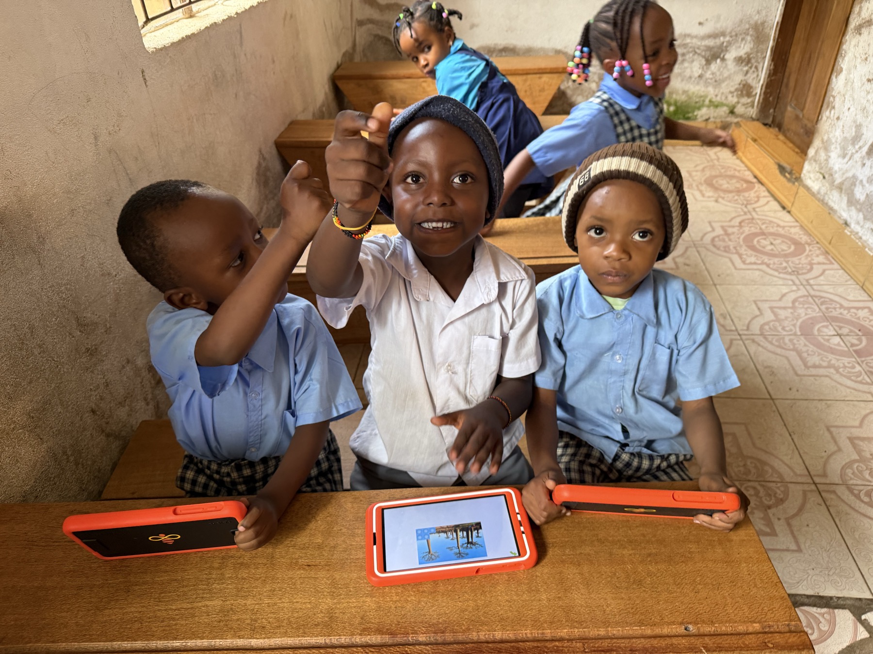 Children learning with tablets in class