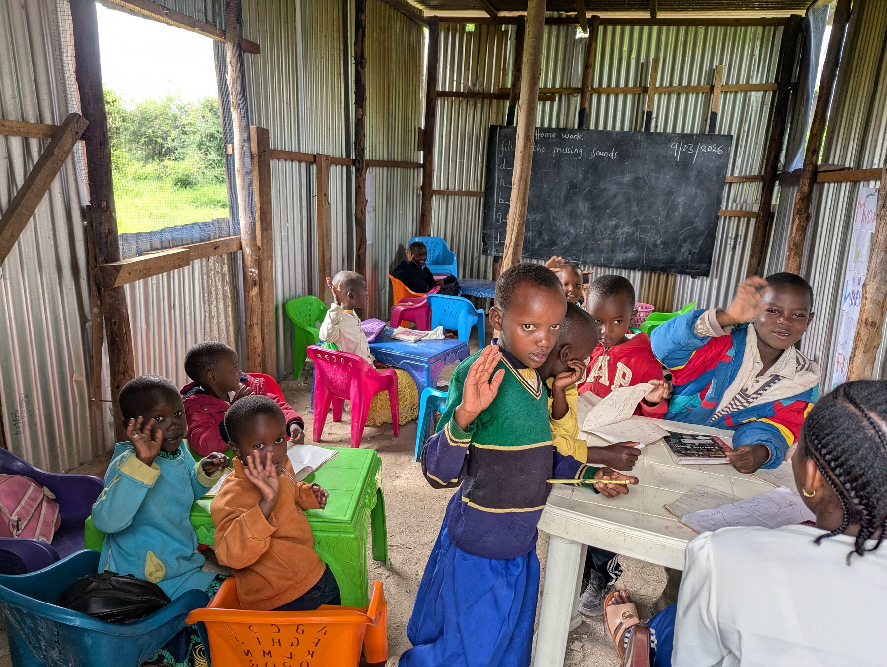 Children reading together in Simanjiro